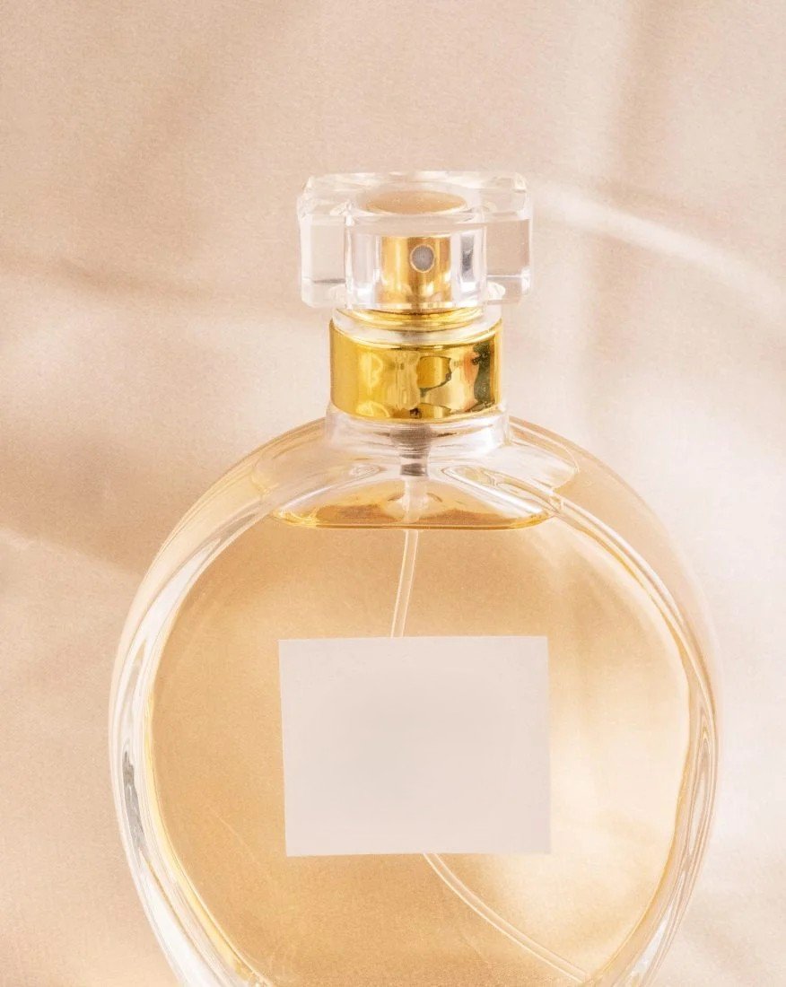 Elegant rose-infused perfume bottle on a bed of fresh petals.